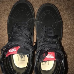 all black high-top Vans